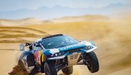 Qatar's Nasser Saleh Al Attiyah and his French co-driver Mathieu Baumel in their Prodrive Hunter during yesterday's stages of the Dubai International Baja. 