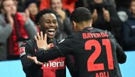 Bayer Leverkusen's English midfielder #19 Nathan Tella (L) celebrates scoring his team's fourth goal with Bayer Leverkusen's French forward #21 Amine Adli during the German first division Bundesliga football match Bayer 04 Leverkusen v 1 FC Union Berlin in Leverkusen, western Germany on November 12, 2023. (Photo by INA FASSBENDER / AFP) 
