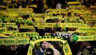 Nantes' supporters cheer their team during the French L1 football match between FC Nantes and OGC Nice at La Beaujoire stadium in Nantes, western France on December 2, 2023. (Photo by LOIC VENANCE / AFP)