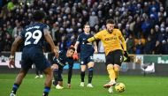Wolverhampton Wanderers' Northern Irish defender #02 Matt Doherty (R) shoots and scores his team second goal during the English Premier League football match between Wolverhampton Wanderers and Chelsea at the Molineux stadium in Wolverhampton, central England on December 24, 2023. (Photo by Paul ELLIS / AFP)