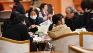 Evacuees rest at a shelter in Nanao, Ishikawa prefecture on January 3, 2024. (Photo by Kazuhiro Nogi / AFP)