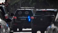 Federal Police vehicles drive on their way to the Federal Police headquarters after a raid on the house of councilman Carlos Bolsonaro in Rio de Janeiro, Brazil, on January 29, 2024. (Photo by MAURO PIMENTEL / AFP)
