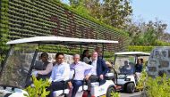 This handout photograph taken and released by Statue Of Unity PRO on March 1, 2024, shows Microsoft co-founder Bill Gates (C) in a golf cart as he tours Kevadiya in India's Gujarat state. (Photo by Statue Of Unity, PRO / AFP) 