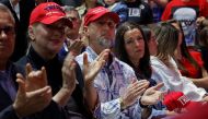 Laken Riley's parents Jason Riley (C) and Allyson Philips attend Republican presidential candidate and former U.S. President Donald Trump's campaign rally at the Forum River Center March 09, 2024 in Rome, Georgia. (Photo by CHIP SOMODEVILLA / GETTY IMAGES NORTH AMERICA / Getty Images via AFP)
