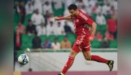 Al Arabi's Omar Al Somah heads the ball to score their second goal against Al Sadd.