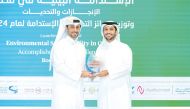 Minister of Municipality H E Abdullah bin Hamad bin Abdullah Al Attiyah presenting the award to Al Abdulghani Motors CEO, Abdulghani Nasser Al Abdulghani.
