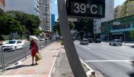 View of a street thermometer reading 39 degrees Celsius (102.2 F) in the city of Sao Paulo, Brazil, on March 17, 2024. Photo by Miguel SCHINCARIOL / AFP