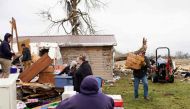 Families and neighbors help each other clean up after a tornado struck the area on March 15th, 2024 in Indian Lake, Ohio. (Photo by Andrew Spear / GETTY IMAGES NORTH AMERICA / Getty Images via AFP)
