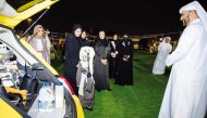 Minister of Social Development and Family H E Maryam bint Ali bin Nasser Al Misnad with other officials and participants during the exhibition.