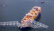 BALTIMORE, MARYLAND - MARCH 26: In an aerial view, cargo ship Dali is seen after running into and collapsing the Francis Scott Key Bridge on March 26, 2024 in Baltimore, Maryland. Photo by TASOS KATOPODIS / GETTY IMAGES NORTH AMERICA / Getty Images via AFP.
