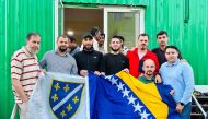 Members of the Bosnian community pose for a picture during an Iftar event.