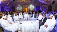 QIB CEO Bassel Gamel with other officials during the annual staff Ramadan Ghabga.