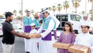 Ooredoo Qatar CEO Sheikh Ali bin Jabor Al Thani and other officials distributing Iftar pack during the holy month of Ramadan.