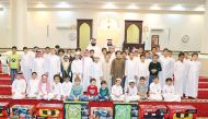 Contest winners with officials of the Ministry of Awqaf during the prize presentation.