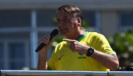 Former Brazilian President Jair Bolsonaro speaks to supporters during a demonstration at Copacabana Beach in Rio de Janeiro, Brazil, on April 21, 2024. (Photo by MAURO PIMENTEL / AFP)
