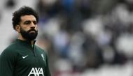 Liverpool's Egyptian striker #11 Mohamed Salah warms up ahead of the English Premier League football match between West Ham United and Liverpool at the London Stadium, in London on April 27, 2024. (Photo by Ben Stansall / AFP)