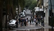 People observe a flooded street at the historical center of Porto Alegre, Rio Grande do Sul state, brazil on May 3, 2024. (Photo by Anselmo Cunha / AFP)
