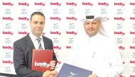 Director of Support Services at Waseef Khalifa Salman Al Muhannadi and  the Chief Operating Officer at Badr Technologies Shadi Mohammed Khair Shhadah exchanging documents after singing the agreement.