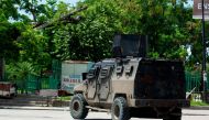 A police tank patrols the area where armed gangs have spread terror, in Port-au-Prince, Haiti, on May 24, 2024. Photo by Clarens SIFFROY / AFP.