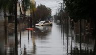 A car is partially submerged in a flooded street in the Sarandi neighborhood, one of the hardest hit by the heavy rains in Porto Alegre, Rio Grande do Sul state, Brazil, on May 27, 2024. Photo by Anselmo Cunha / AFP