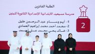 Maha Zayed Al Qaqaa Al Ruwaili, Assistant Undersecretary for Educational Affairs (second right) with other officials and students during the event.
