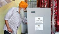 A man casts his ballot to vote at a polling station in Amritsar on June 1, 2024, during the seventh and final phase of voting in India's general election. Photo by Narinder NANU / AFP.