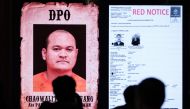 A monitor shows Thai fugitive Chaowalit Thongduang, who escaped from a hospital in Thailand while serving his sentence in 2023, during a press conference after he was arrested by Indonesian police in Bali, at the National Police Criminal Investigation Agency (BARESKRIM) office in Jakarta on June 2, 2024. Photo by Yasuyoshi CHIBA / AFP.