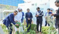 Officials planting a tree to mark World Environment Day at Lulu Hypermarket’s D Ring Road branch.