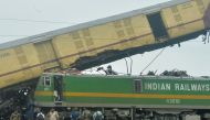 Railway workers help to restore services at the accident site following a collision between a passenger and a goods train in Nirmaljote, near Rangapani station in India's West Bengal state, on June 17, 2024. (Photo by DIBYANGSHU SARKAR / AFP)
