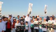 Minister of Environment and Climate Change H E Dr. Abdullah bin Abdulaziz bin Turki Al Subaie (centre) during the campaign at Fuwairit Beach yesterday.
