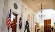 US President Joe Biden walks to deliver remarks on the Supreme Court's immunity ruling at the Cross Hall of the White House in Washington, DC on July 1, 2024. (Photo by Mandel Ngan / AFP)
 