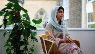 Pakistani Nobel Peace Prize laureate Malala Yousafzai listens to a question during an interview in London on July 12, 2024. (Photo by Benjamin Cremel / AFP)
 