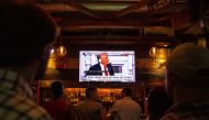 People watch as Donald Trump's GOP candidate acceptance speech is broadcast inside a bar on the final night of the RNC on July 18, 2024 in Milwaukee, Wisconsin. (Photo by Jim Vondruska / GETTY IMAGES NORTH AMERICA / Getty Images via AFP)
