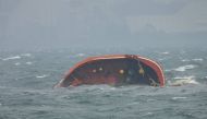 This handout photo taken on July 25, 2024 and received from the Philippine Coast Guard (PCG) shows part of MT Terra Nova oil tanker after it sank off Manila Bay. Photo by Handout / Philippine Coast Guard (PCG) / AFP