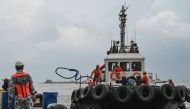 A tugboat from a private company arrives to assist in the oil spill response, at a port in Limay, Bataan on July 26, 2024. Photo by Jam Sta Rosa / AFP
