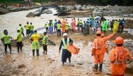 Relief personnel conduct a search and rescue operation after landslides in Wayanad on July 31, 2024. (Photo by Idrees Mohammed / AFP)