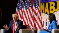 Former US President and 2024 Republican presidential nominee Donald Trump answers questions as moderator and journalist Rachel Scott looks on during the National Association of Black Journalists annual convention in Chicago, Illinois, on July 31, 2024. (Photo by Kamil Krzaczynski / AFP)