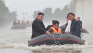This recent undated photo released by North Korea's official Korean Central News Agency (KCNA) via KNS on July 31, 2024 shows North Korea's leader Kim Jong Un riding in a dingey through flood waters as he inspects the area for damage after record-breaking heavy rains on July 29 in the city of Sinuiju in North Pyongan Province. Photo by KCNA VIA KNS / AFP.