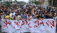 Students shout slogans during a protest march as they demand justice for victims arrested and killed in the recent nationwide violence over job quotas, in Dhaka on August 3, 2024. Photo by MUNIR UZ ZAMAN / AFP.