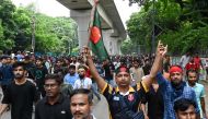 Protesters block the Shahbagh intersection during a protest in Dhaka in August 4, 2024, to demand justice for the victims arrested and killed in the recent nationwide violence during anti-quota protests.  (Photo by Munir UZ ZAMAN / AFP)
