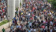 Anti-government protestors march towards Bangladesh prime minister's residence in Dhaka on August 5, 2024. Photo by Munir UZ ZAMAN / AFP