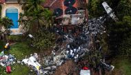 This photo shows an aerial view of the wreckage of an airplane that crashed with 61 people on board in Vinhedo, SAO PAULO State, Brazil, on August 10, 2024.(Photo by Nelson ALMEIDA / AFP)
