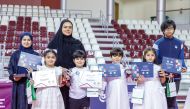 Kids receiving participation certificates during conclusion ceremony of Aspire Summer Camp 2024.
