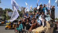 A convoy of Taliban security personnel seen moving along the streets as they celebrate the third anniversary of Taliban takeover of Afghanistan, in Herat on August 14, 2024. (Photo by Mohsen KarimI / AFP)
