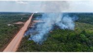 Aerial image of an area of Amazon rainforest affected by illegal fire on the banks of the BR-319 road between Porto Velho, Rondonia State and Manaus, Amazonas State, northern Brazil, on August 22, 2024. (Photo by EVARISTO SA / AFP)
