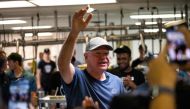 Democratic vice presidential nominee Minnesota Gov. Tim Walz thanks supporters after serving ice cream at the Dairy Barn in the Minnesota State Fair on September 1, 2024 in Falcon Heights, Minnesota. (Photo by Stephen Maturen / GETTY IMAGES NORTH AMERICA / Getty Images via AFP)
