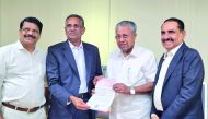 Chairman of Safari Group of Companies, Aboobacker Madappat, and Managing Director, Zainul Abideen, handing over the cheque to Chief Minister of Kerala Pinarayi Vijayan at Government Secretariat, Thiruvananthapuram.
