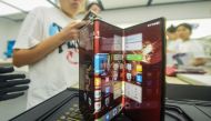 Chinese tech giant Huawei's new trifold phone Huawei Mate XT is displayed during its launch day at a Huawei store in eastern China's Zhejiang province on September 10, 2024. (Photo by AFP) 
 