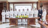 CCQ President Dr. Khalid Mohamed Al Horr (fifth left), CEO of Hassad Food Company Engineer Ali Hilal Al Kuwari (sixth right) and other officials at the agreement signing ceremony.