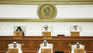 Speaker of the Shura Council H E Hassan bin Abdulla Al Ghanim (top centre) chairing the Shura Council session yesterday. Deputy Speaker H E Dr. Hamda bint Hassan Al Sulaiti (left) and Minister of Justice and Minister of State for Cabinet Affairs H E Ibrahim bin Ali Al Mohannadi (top right) are also seen. 